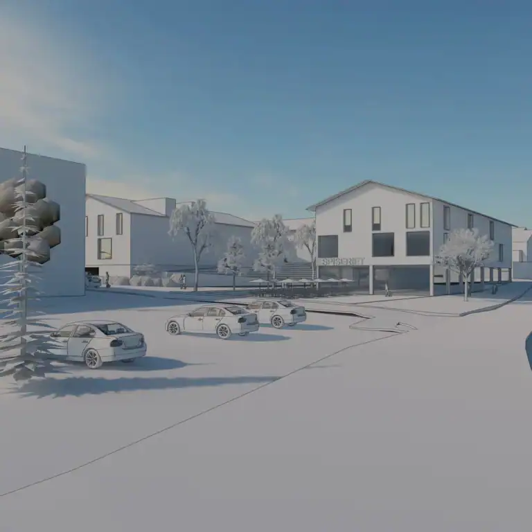 Modern commercial building with outdoor seating and parking in a snowy landscape.