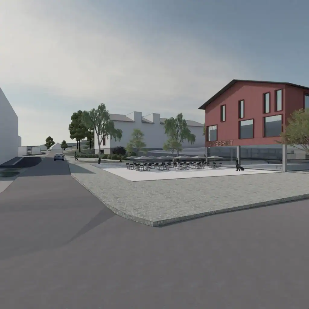 Modern commercial building exterior with outdoor seating area and landscaping, featuring architectural design and urban development.